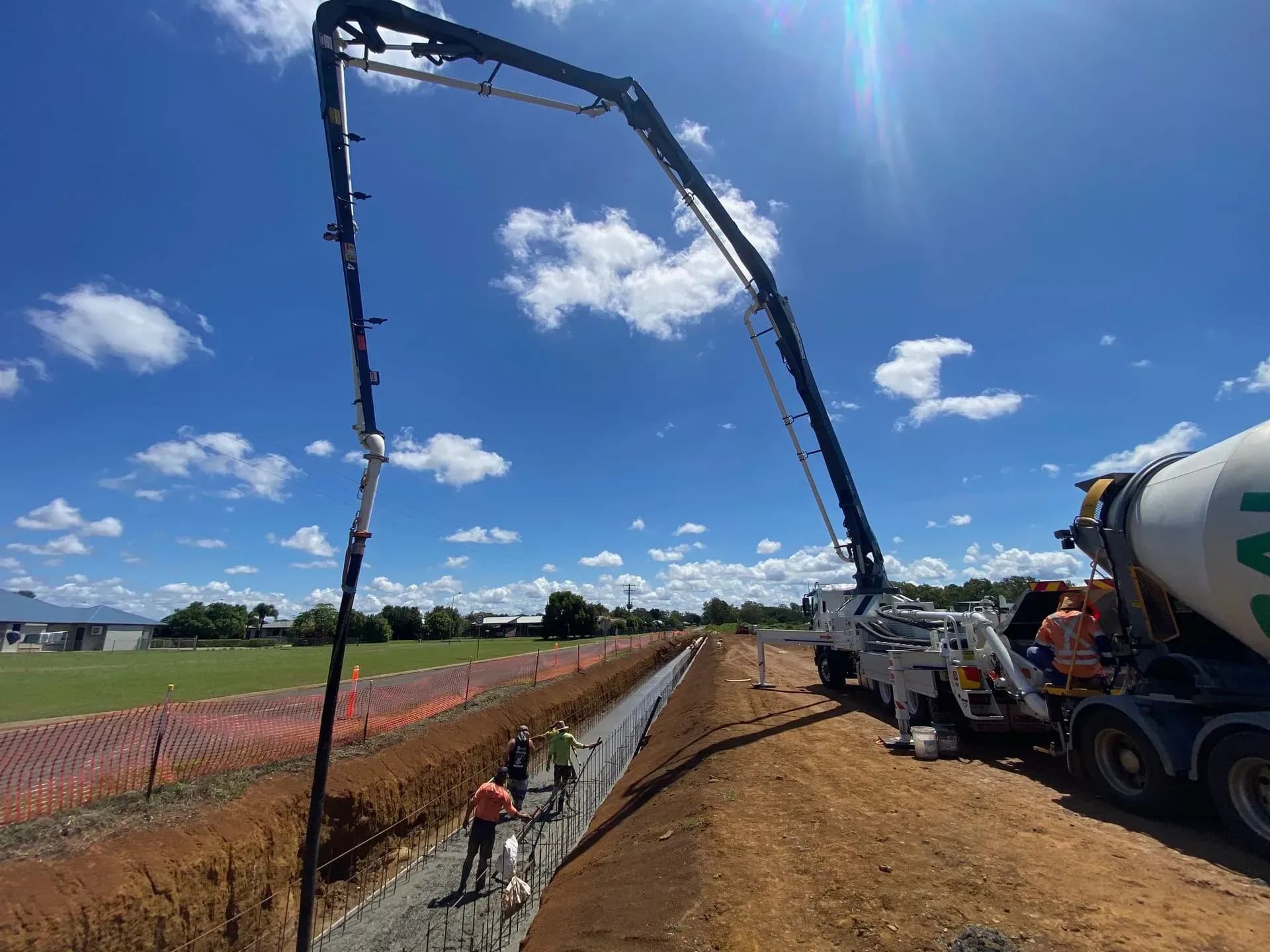 Concrete pump truck working on a commercial building site