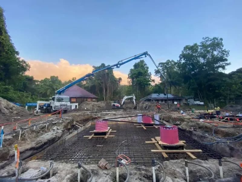 Construction Site Concrete Pump Truck Pouring Concrete — Far Northern Concrete Pumping in Mareeba, QLD