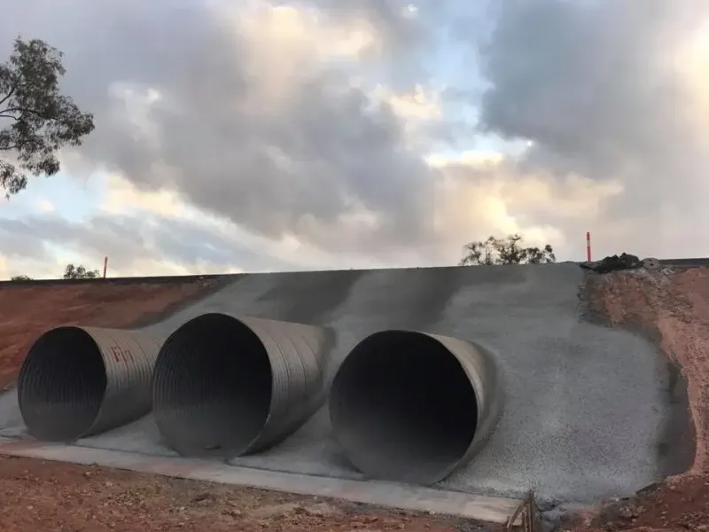 Three Large, Round Culverts Under a Gray Concrete Embankment — Far Northern Concrete Pumping in Mareeba, QLD