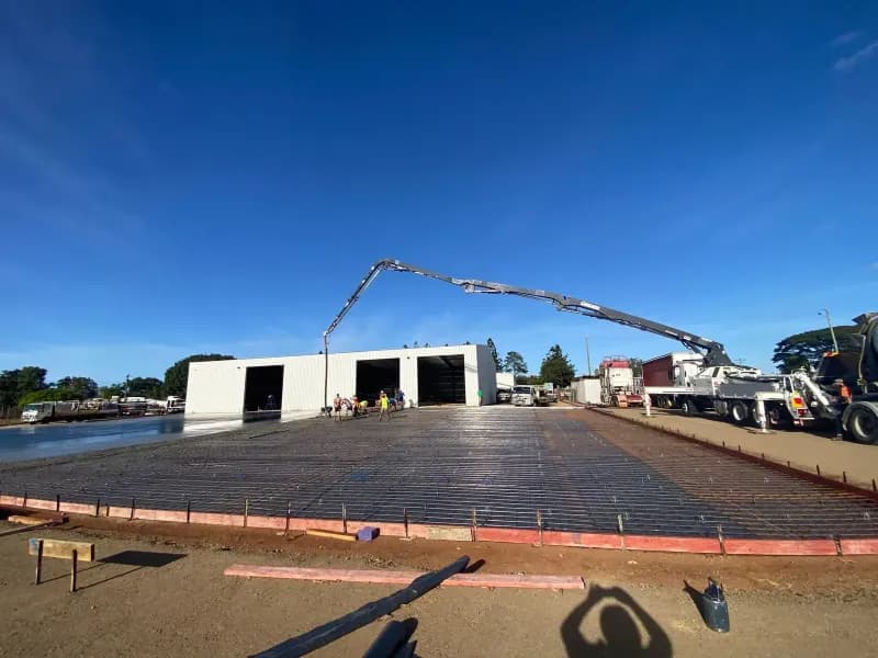 Construction Site Concrete Being Poured by a Pump Truck — Far Northern Concrete Pumping in Mareeba, QLD