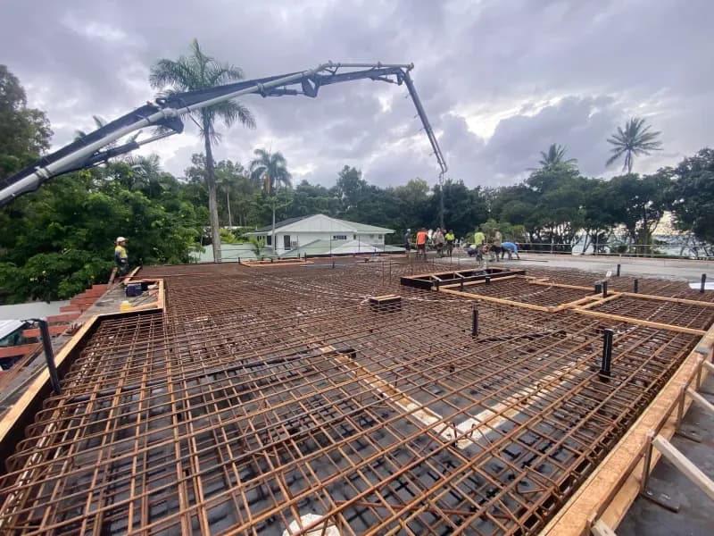 Concrete Being Poured on Rebar Grid, Construction Site — Far Northern Concrete Pumping in Mareeba, QLD