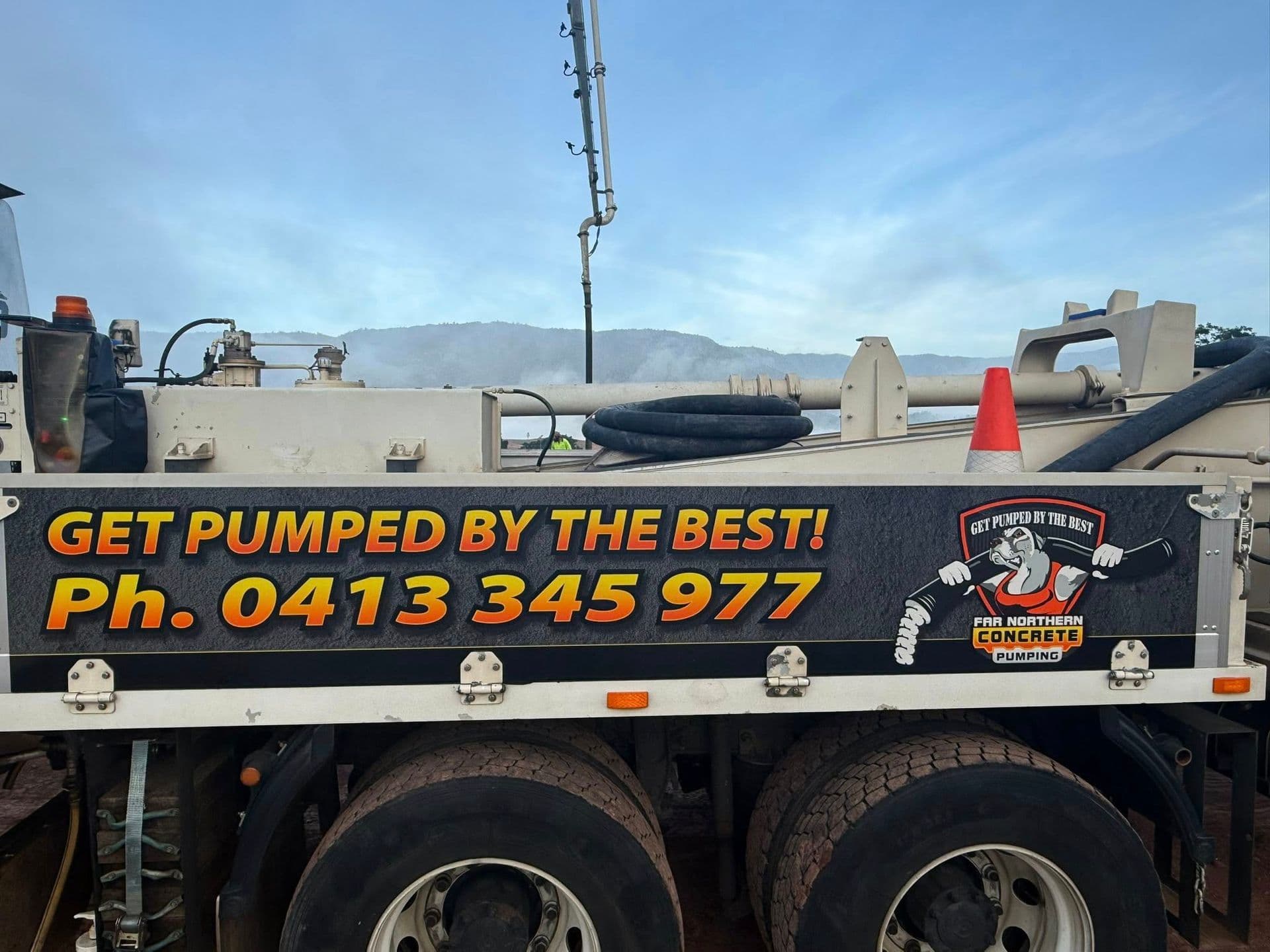 Concrete Pumping Truck With Advertising Text — Far Northern Concrete Pumping